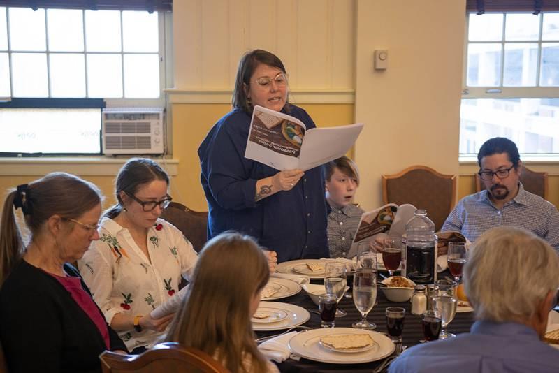 Sara Clarke-De Reza reads from the Haggadah for Hillel's Intersectional Seder